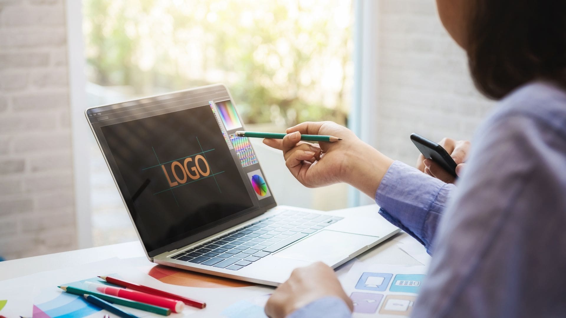 Bad logo design critique on laptop screen