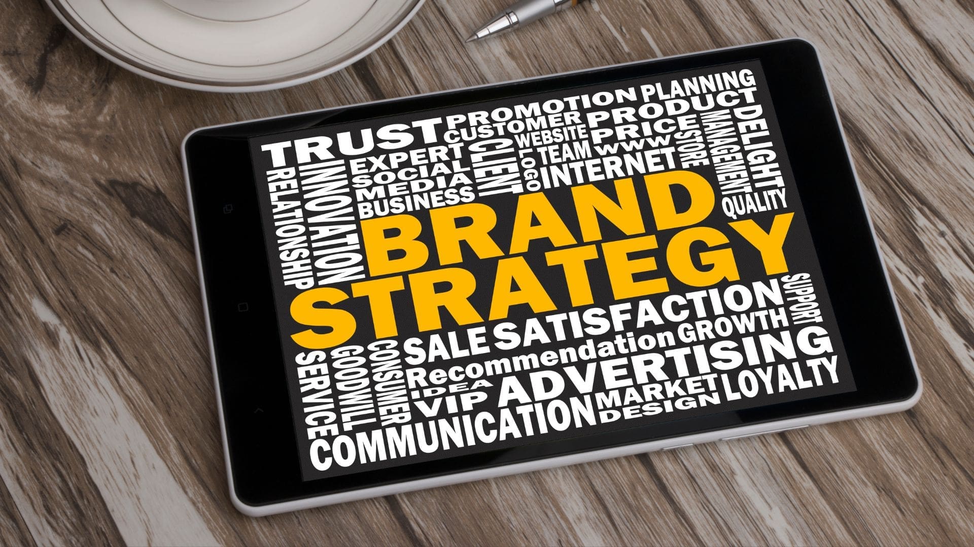 Brand Strategy text cloud on digital tablet